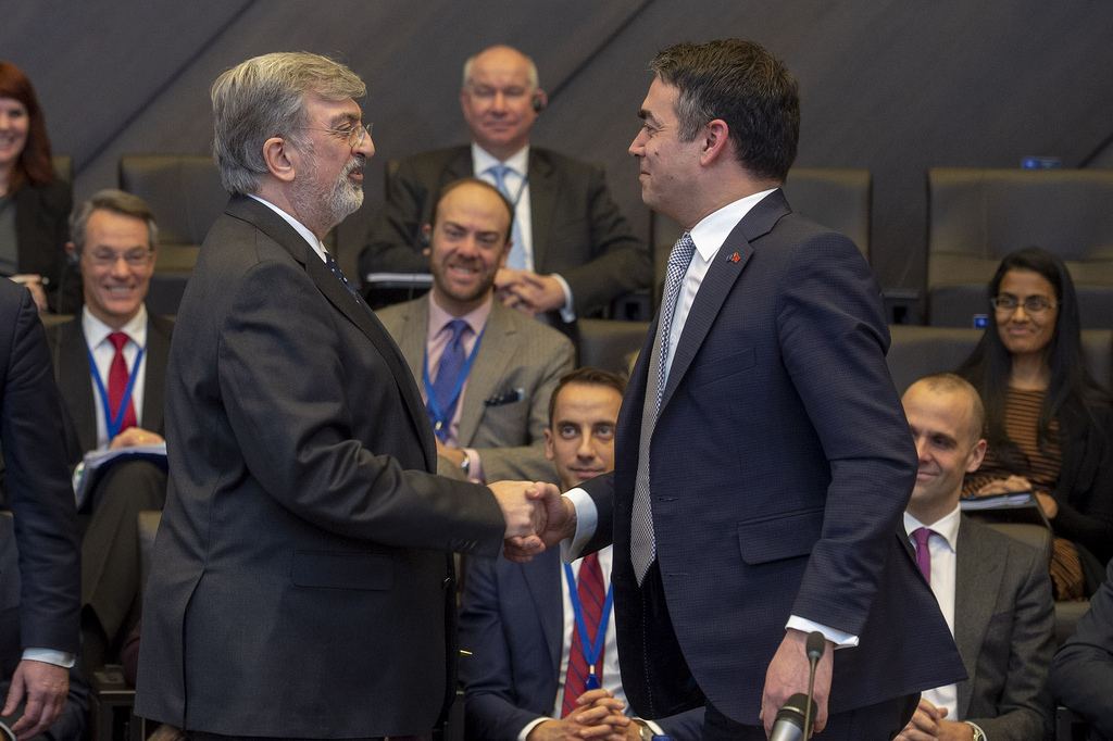 NATO Allies sign Accession Protocol for the future Republic of North Macedonia. Spiros Lambridis, Permanent representative of Greece congratulating the Foreign Minister of the invitee country, Nikola Dimitrov