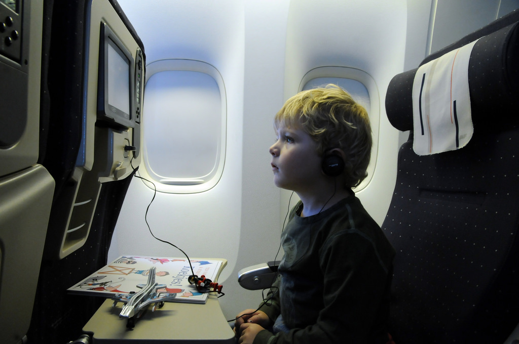 Child watching inflight entertainment system.