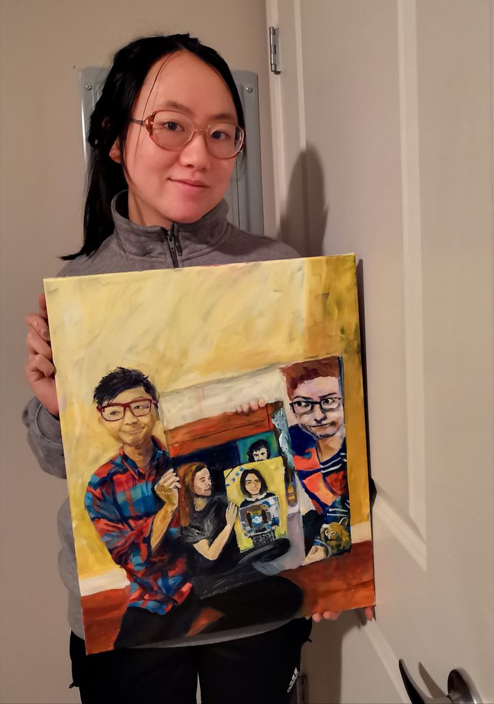 Woman holds painting of the eight paintings that came before her.