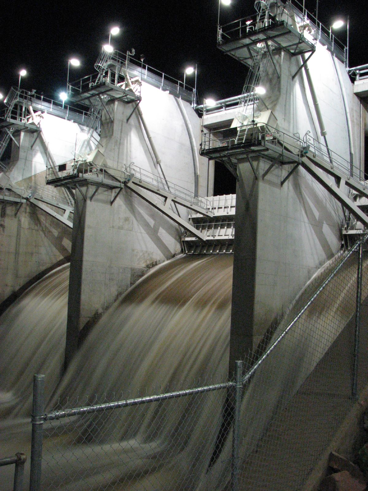 Ross River Dam at night, Floodgates are full open.