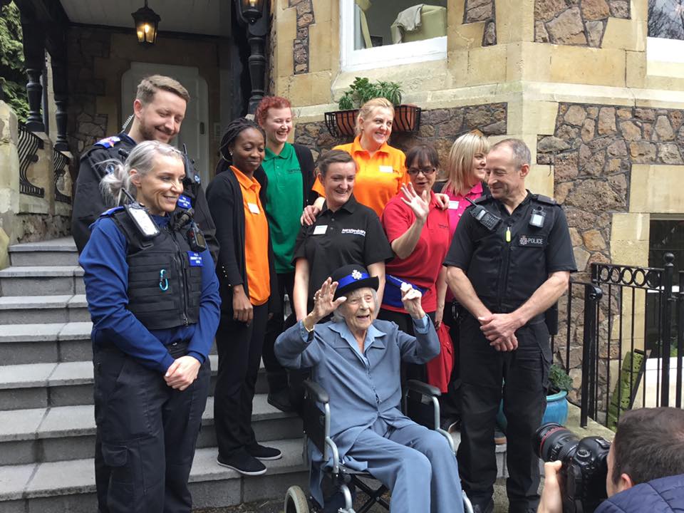 Anne with the police officers and the care home workers.