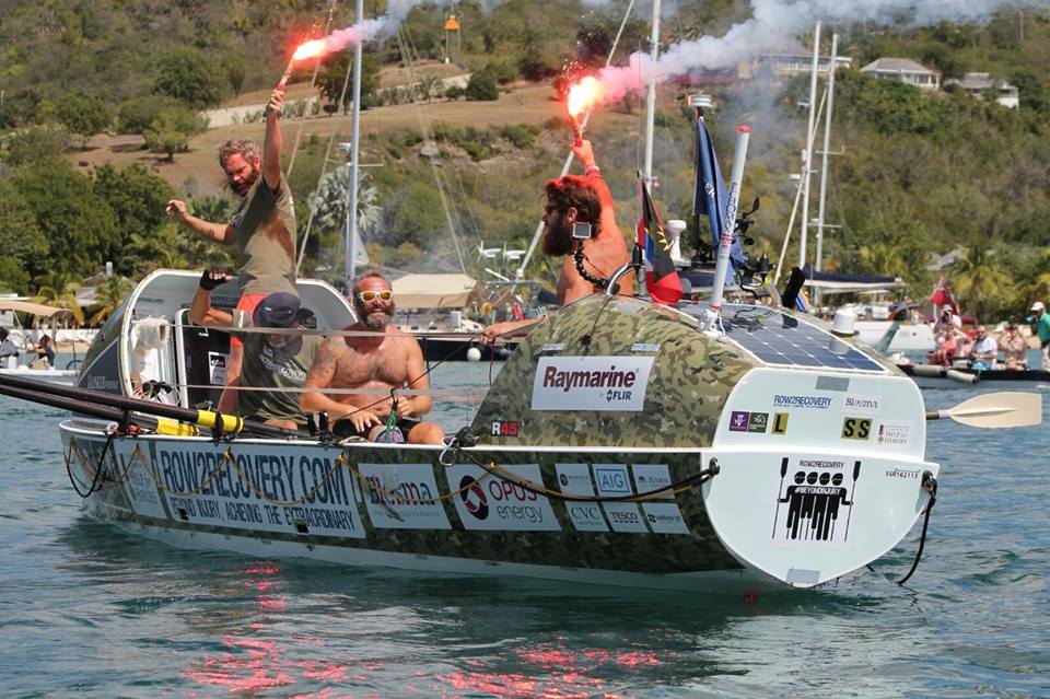 Lee Spencer and three co-sailors in their rowboat.