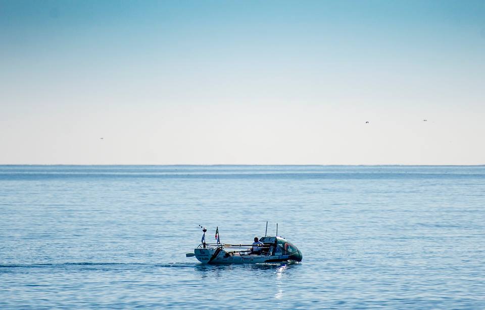 Distant view of Lee Spencer in his rowboat.