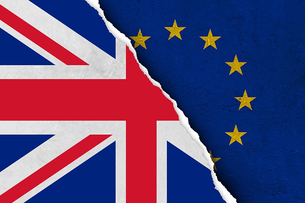 Brexit image - torn UK Flag over EU flag