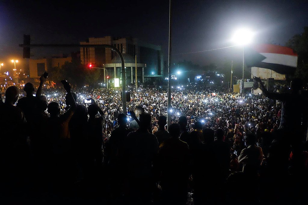 Chanting at night in front of the army HQ in khartoum.