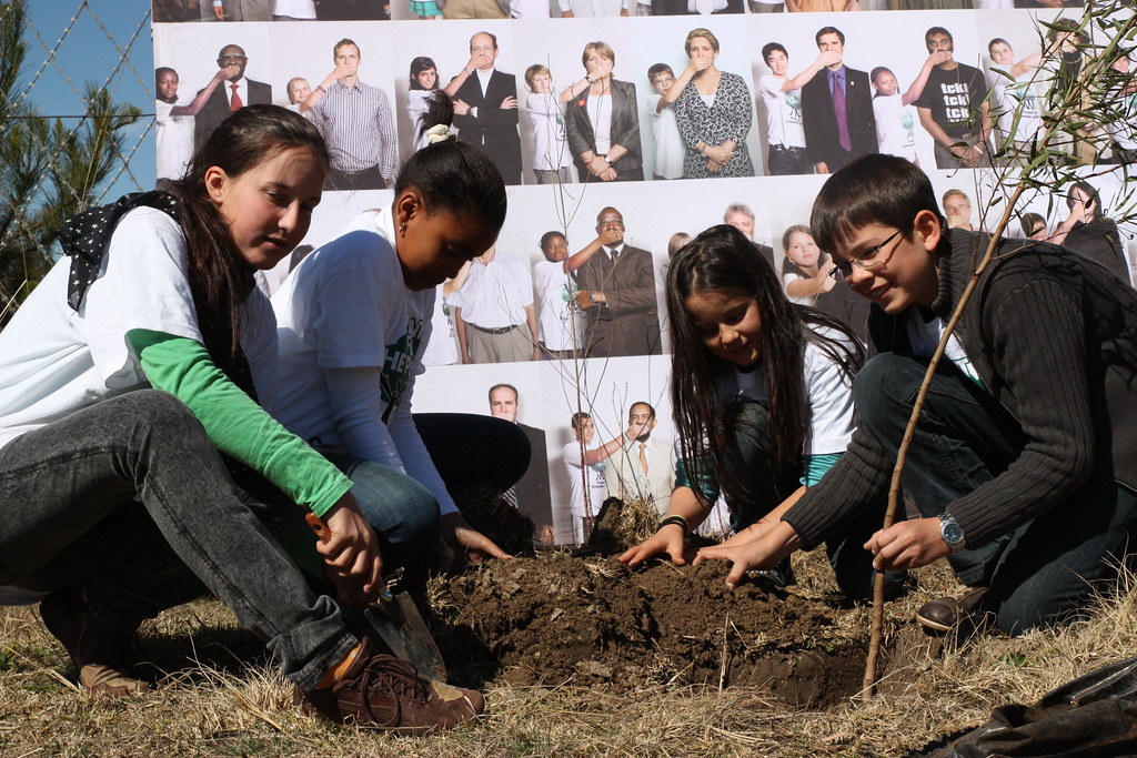 Felix Finkbeiner planting a tree with other kids in Lesotho.