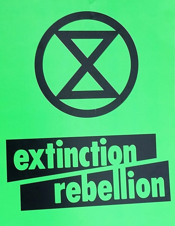 Extinction Rebellion, green placard.