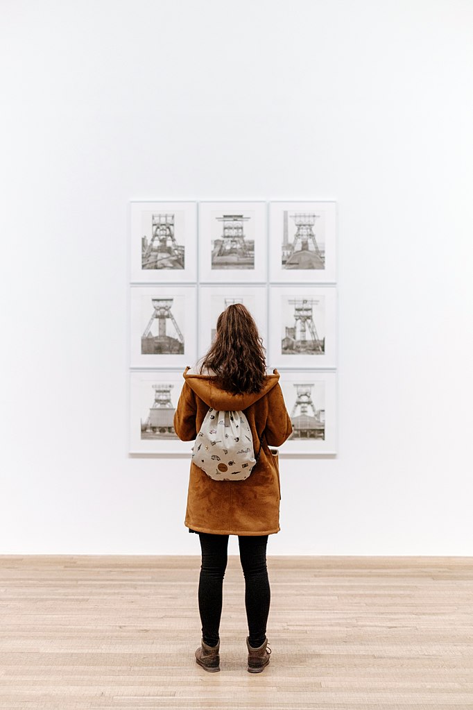 Girl with backpack in art gallery, Tate Modern, London, United Kingdom