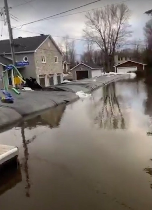 An emergency wall to protect homes from flood waters in Cumberland, Ontario.