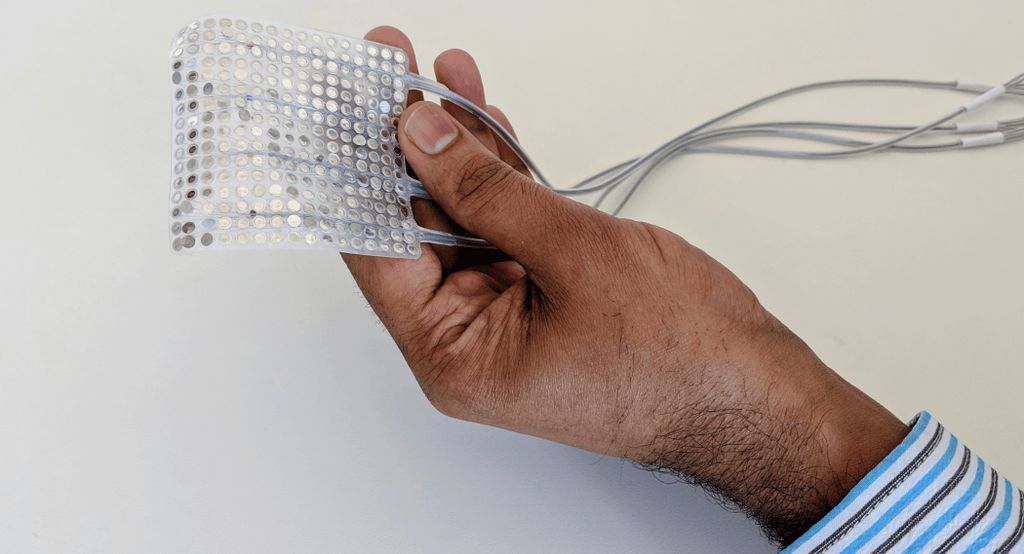 Gopala Anumanchipalli, Ph.D., holding an example array of intracranial electrodes of the type used to record brain activity in the current study. Credit: UCSF