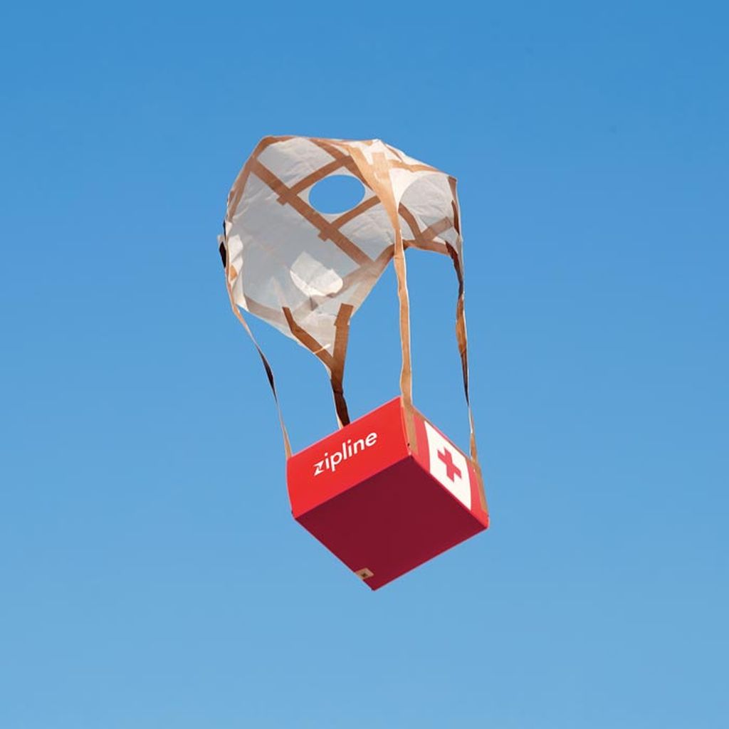 Medical supplies descend by parachute.