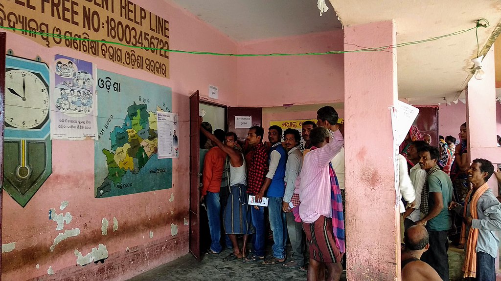 Indian citizens standing in a queue to vote during 2019 elections in Jaydev constituency, Odisha