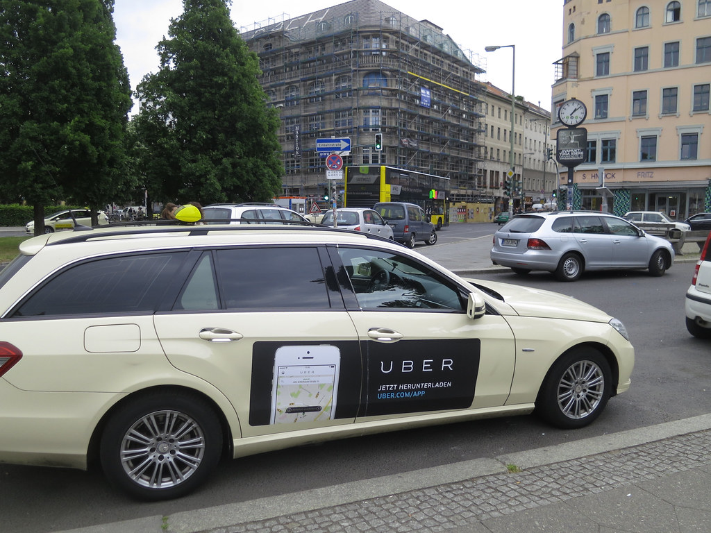 Uber taxi ad on Station wagon in Berlin.