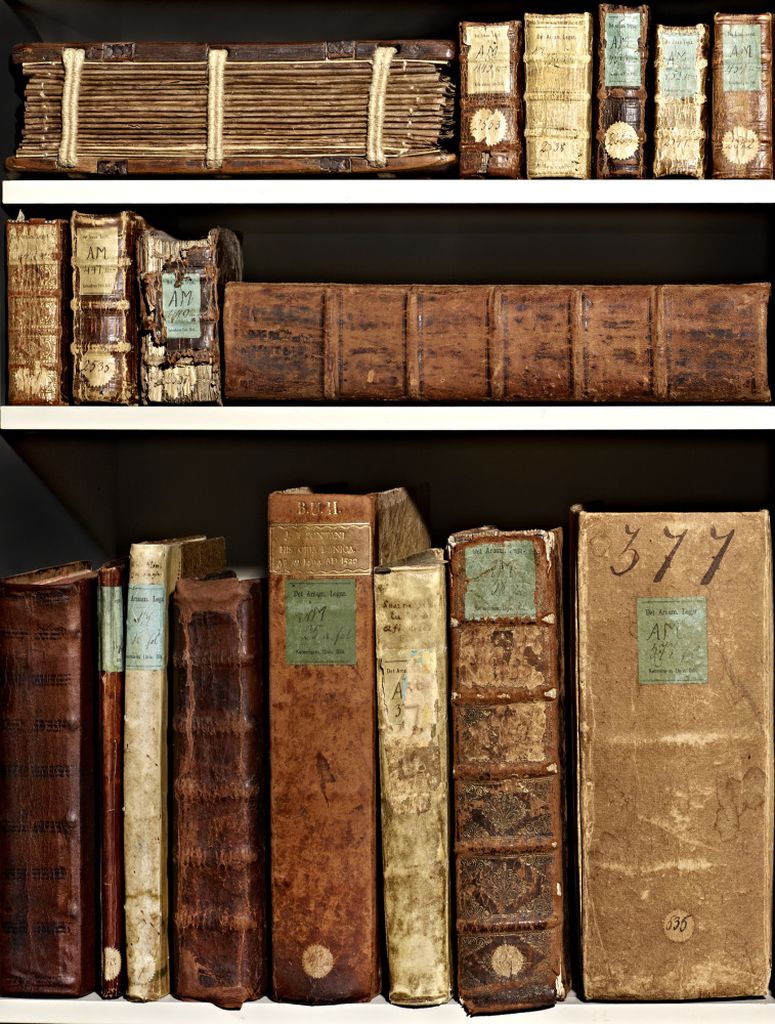 Ancient books on shelves at the Arnamagnæan Collection.