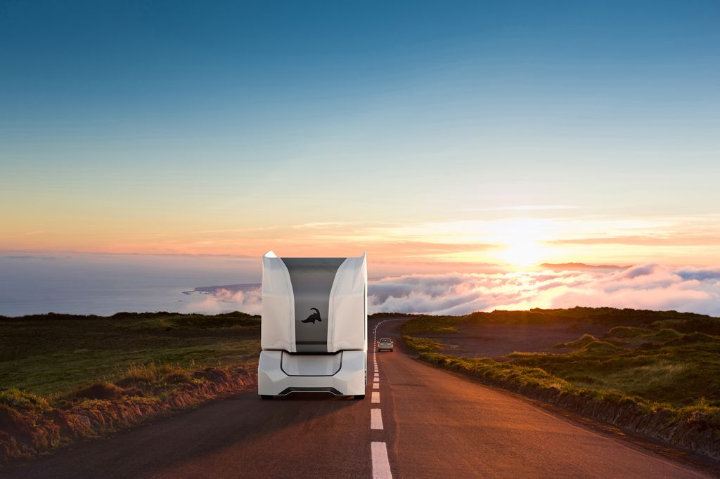 An Einride driverless T-Pod drives down a highway.