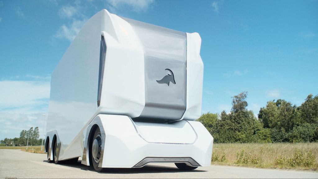 An Einride driverless T-Pod drives down a highway.