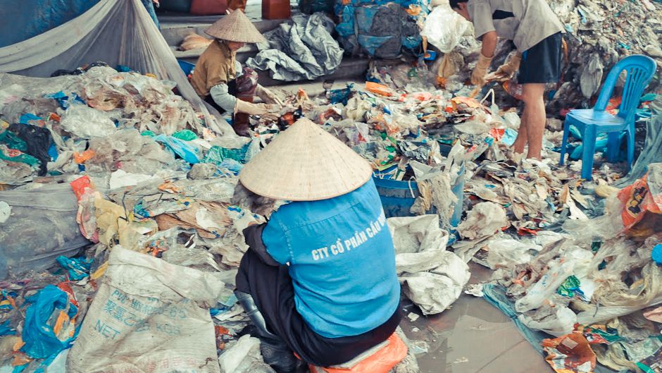 Vietnamese women recycling all sorts of discarded plastic, including from waste streams.