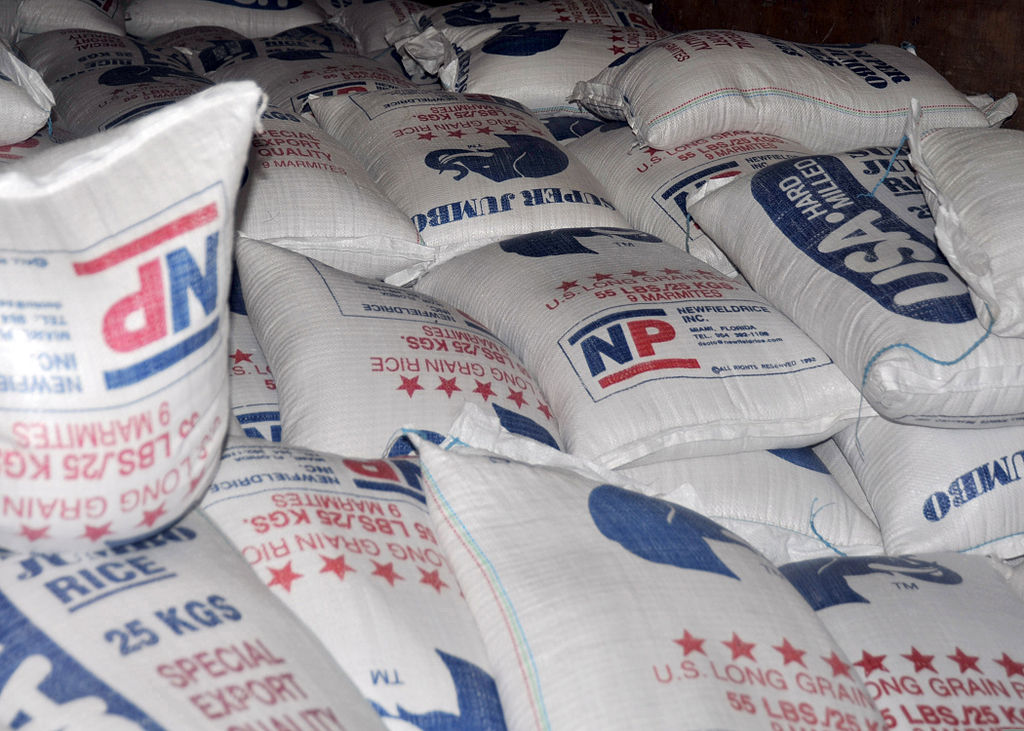 Piles of 55-pound bags of rice that will be distributed by the World Health Organization are photographed Jan. 31, 2010