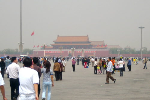 The view across Tiananmen Square to the Forbidden City. It isn't dusk, it's just really polluted.