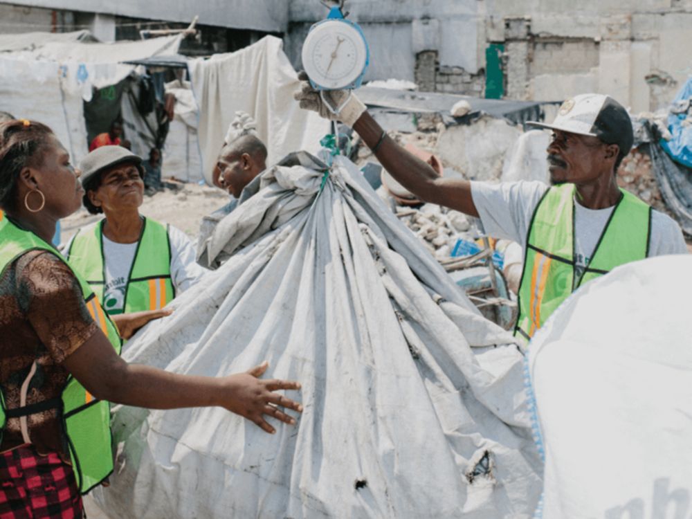 Weighing recycling in Haiti.