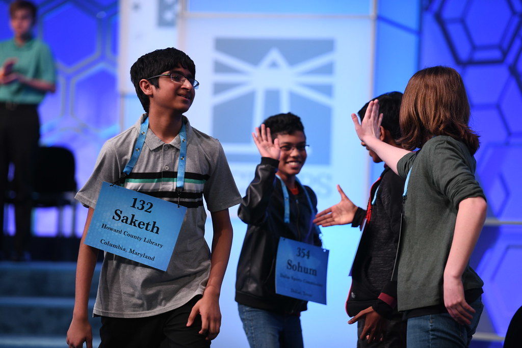 Students high-five each other at the 2019 Scripps National Spelling Bee.