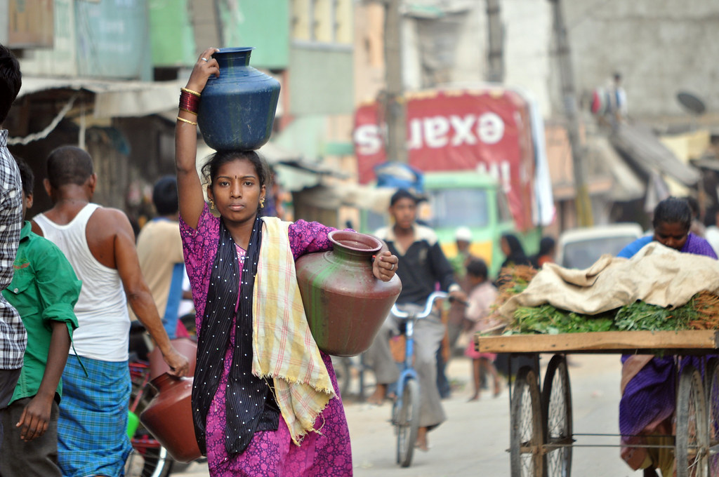 Woman with water jugs