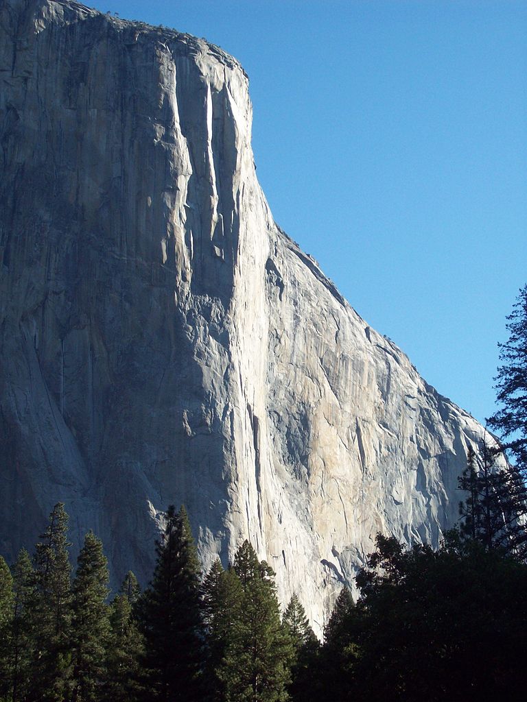 The 2800 foot 'Nose Route' of El Capitan ascends a line meandering for roughly 30 rope lengths in the vicinity of where the sun meets the shade.