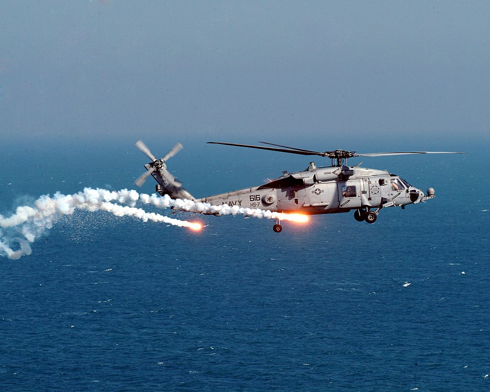 An HH-60H Seahawk assigned to the " Dusty Dogs" of Helicopter Anti-Submarine Squadron Seven (HS-7), test dispenses flares and chaff from the on board AN/AAR-47 system.