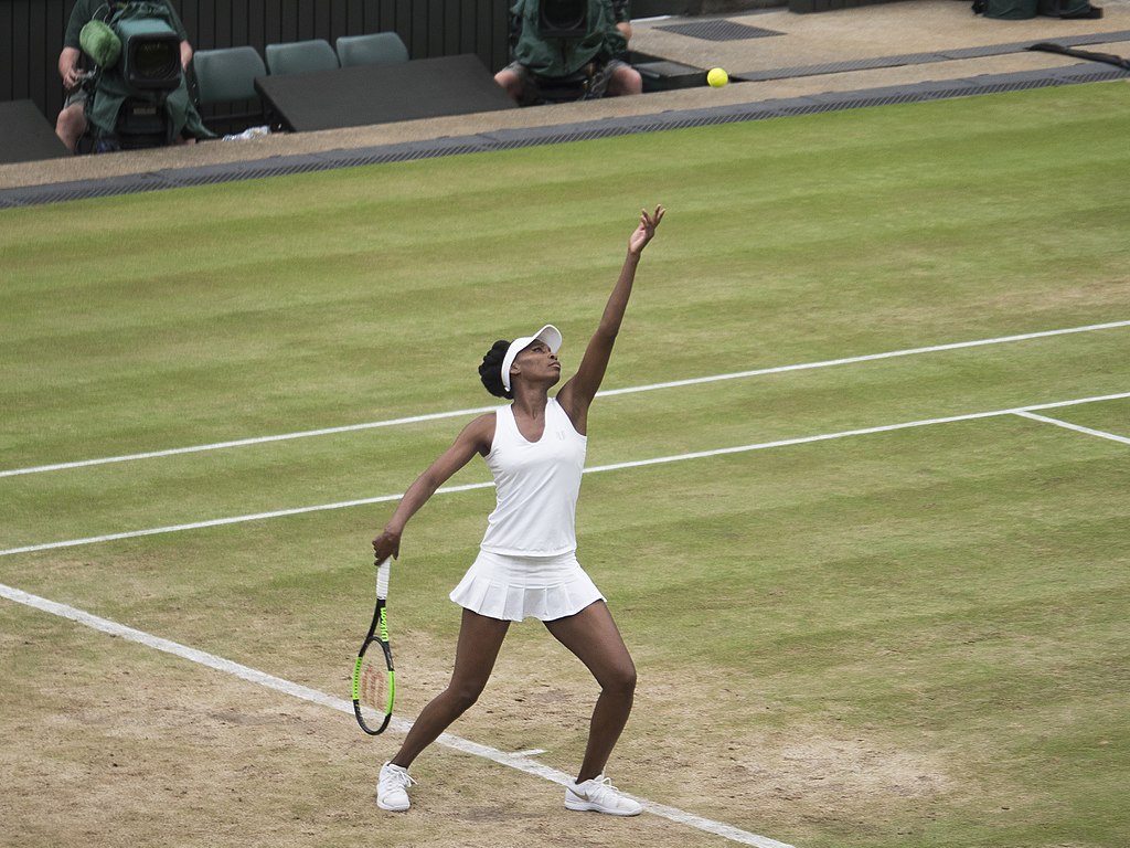 Venus Williams serving at Wimbledon in 2017