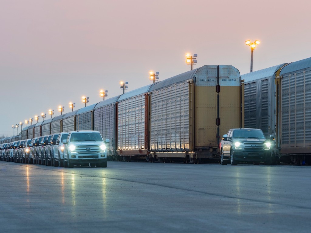 An electric truck made by Ford pulls a 1,000,000 pound train as part of a demonstration.