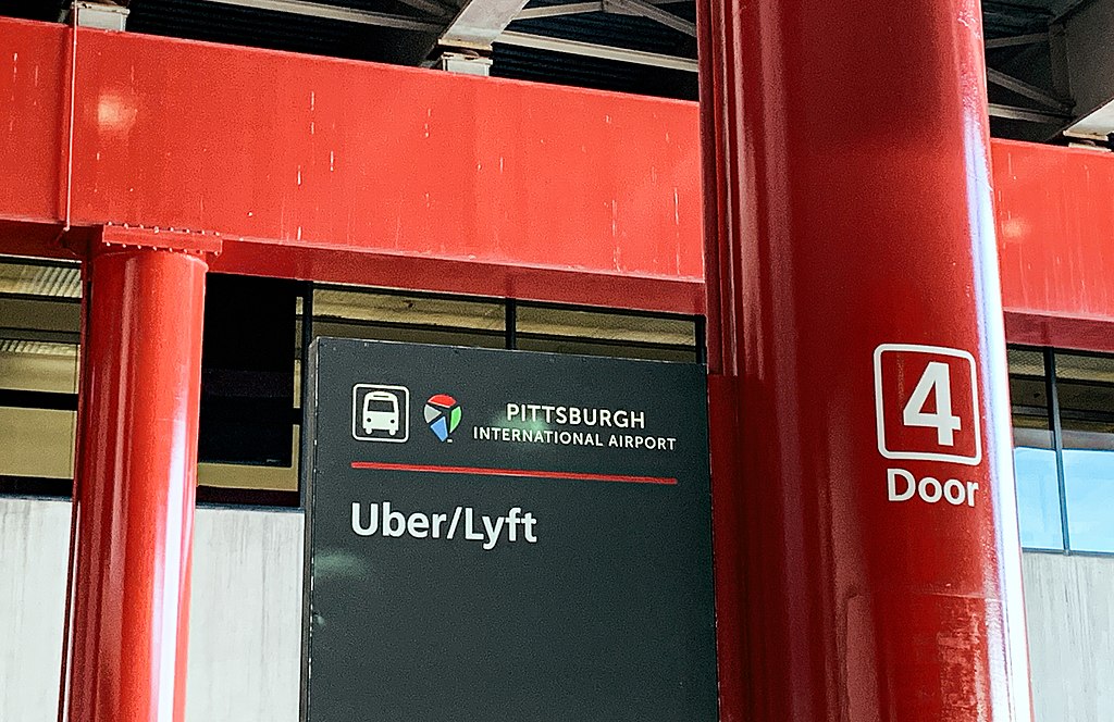 The designated door for flight arrival pickup by Uber and Lyft drivers, at Pittsburgh International Airport in Pittsburgh, Pennsylvania.