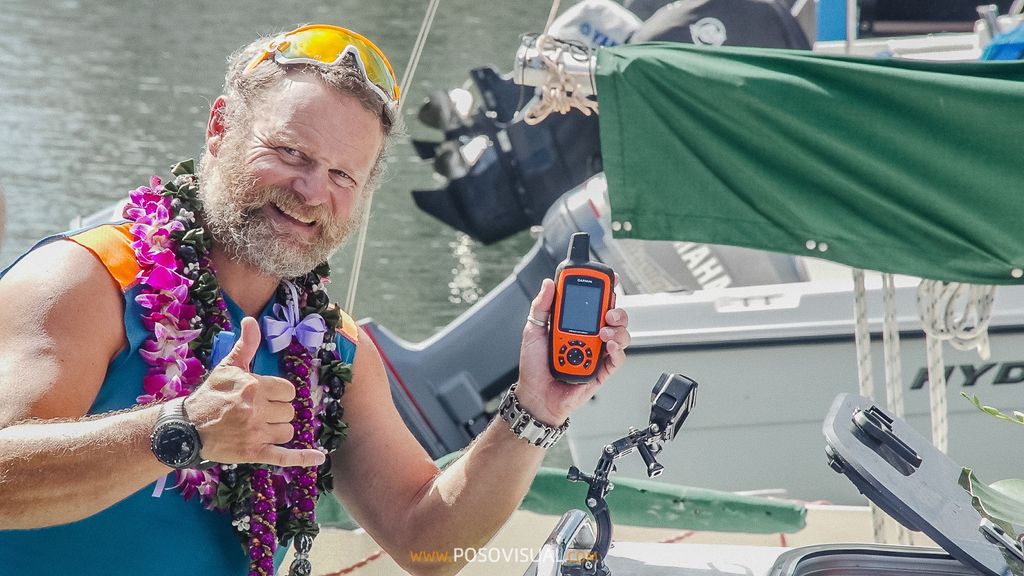 Mr. de la Rosa gives a thumbs up with his GPS device.