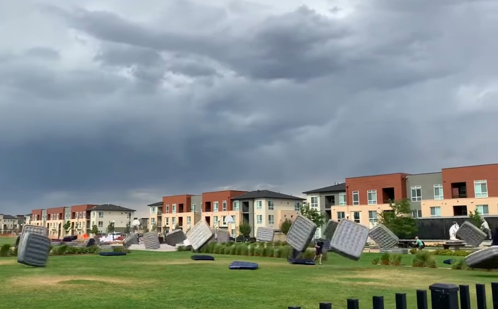 Dozens of air mattresses go cartwheeling across a field near Denver, Colorado.