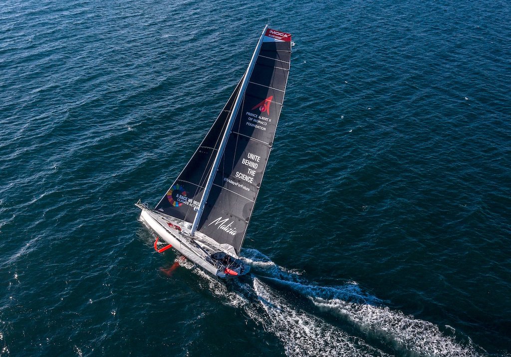Aerial shot of the racing yacht Malizia II with a special "climate action" sail.