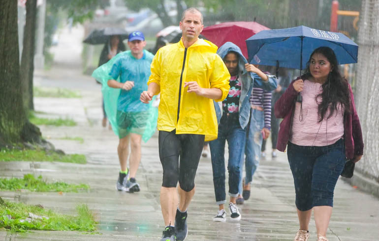 Smarana Puntigam running in the rain in the Sri Chinmoy 3,100 mile race.