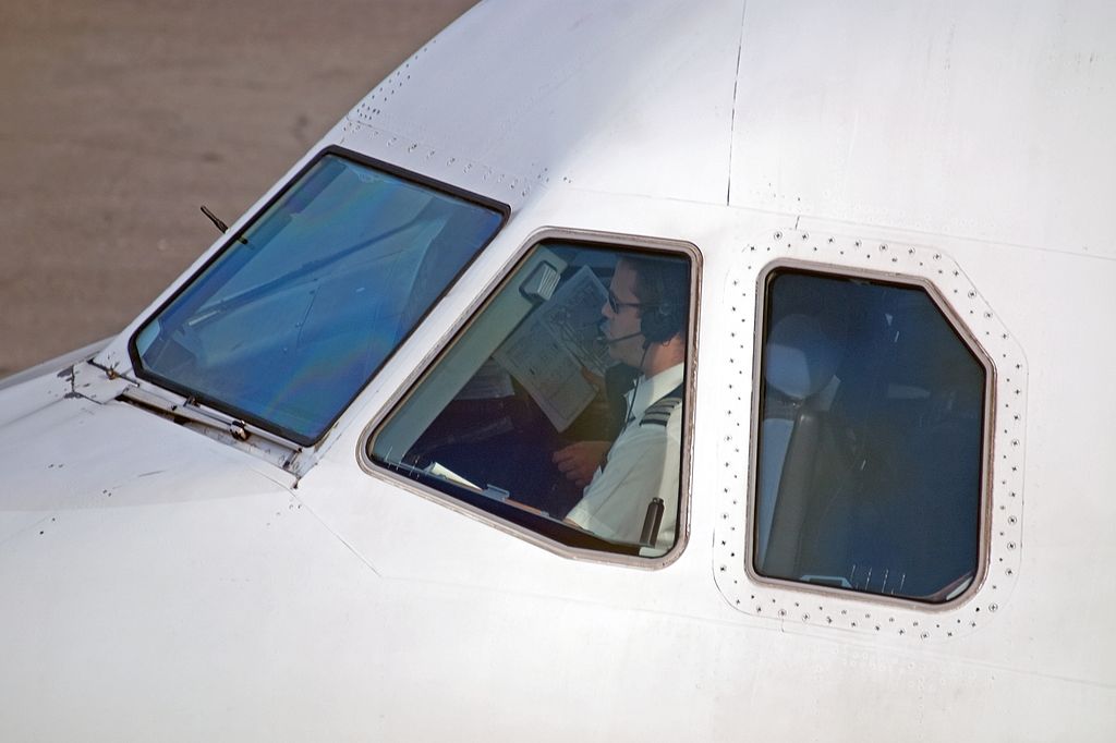 Cockpit detail with the co-pilot still studying the schiphol airport layout. Airbus A319-131 Amsterdam schiphol EHAM (29-02-2008)