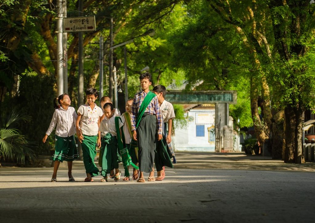 Children walking to school in Myanmar.