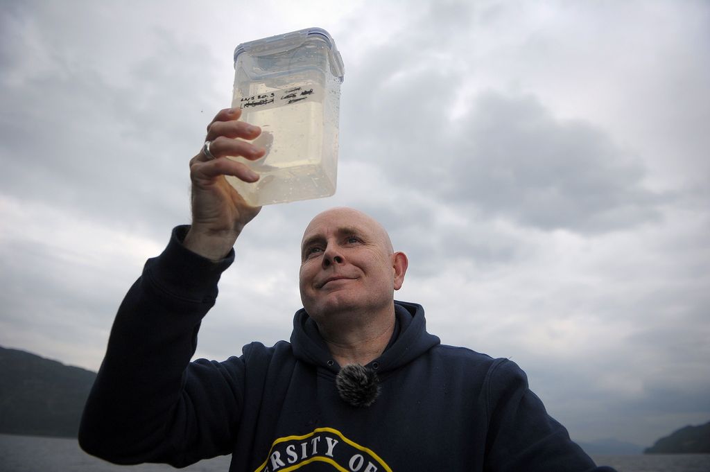 Professor Neil Gemmell looking at a water sample from Loch Ness