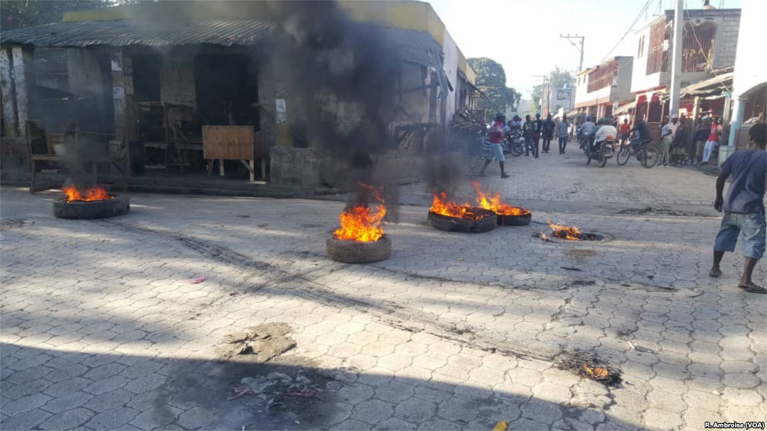 Flaming tires seen early on February 11, 2019, in the streets of Hinche in the center of Haiti.