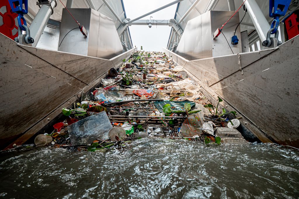 View of the Ocean Cleanup's Interceptor's conveyor belt removing trash from the river.