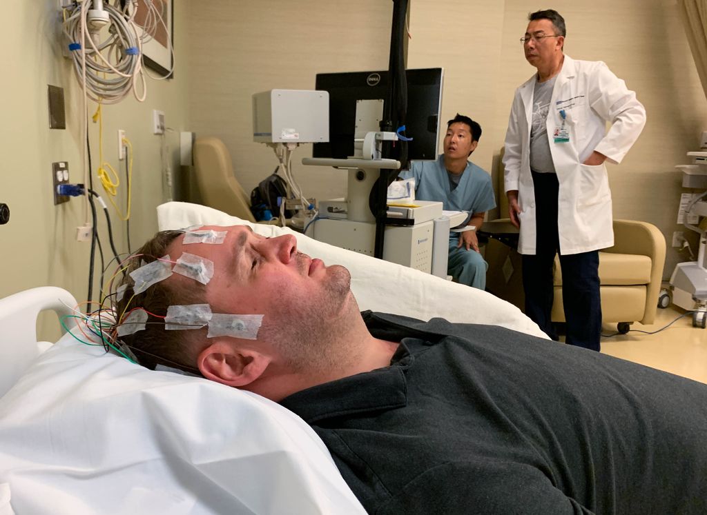 Researchers at UCLA Health use EEG to observe brain activity in Jason Esterhuizen.