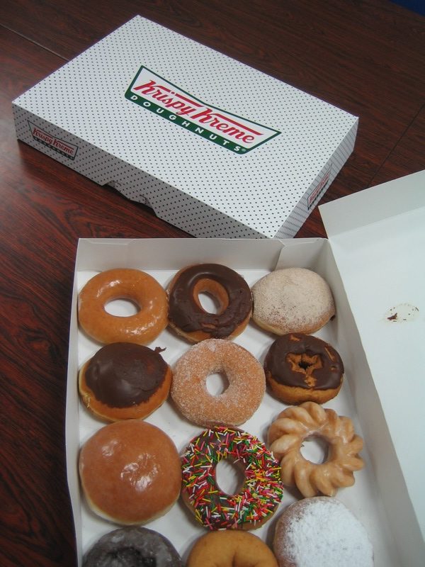 Krispy Kreme doughnuts - 1 box open, 1 box closed