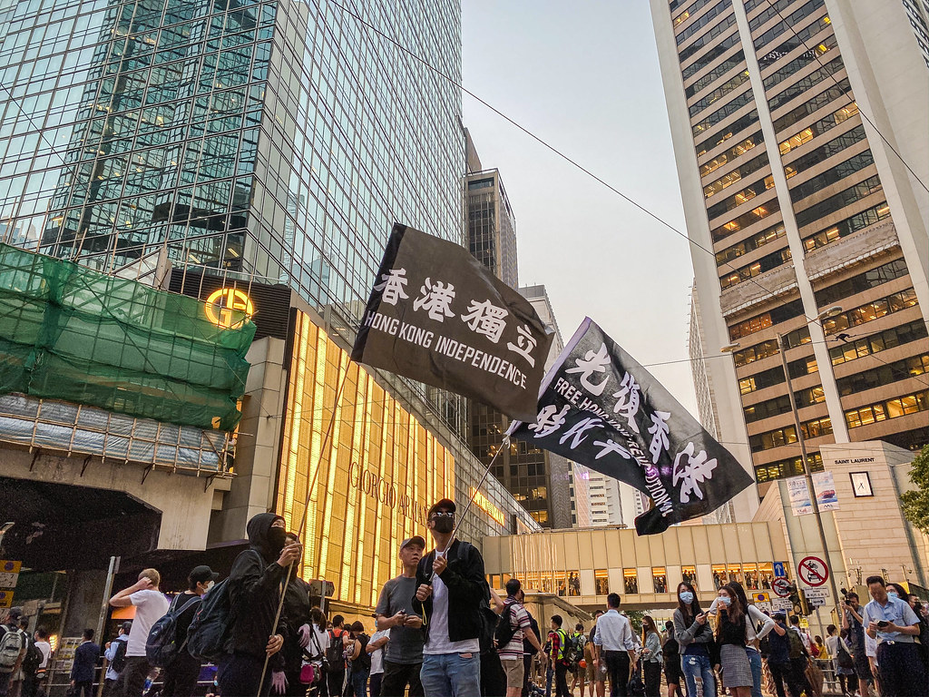 Protester waving a banner saying "Hong Kong Independence".