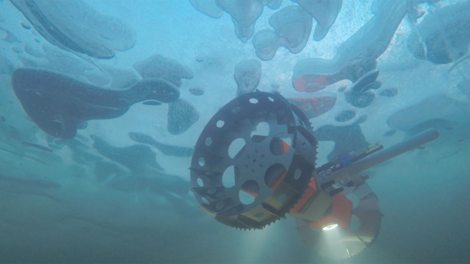 NASA's BRUIE, or the Buoyant Rover for Under-Ice Exploration, a two-wheeled underwater rover, is being tested under an Arctic lake.