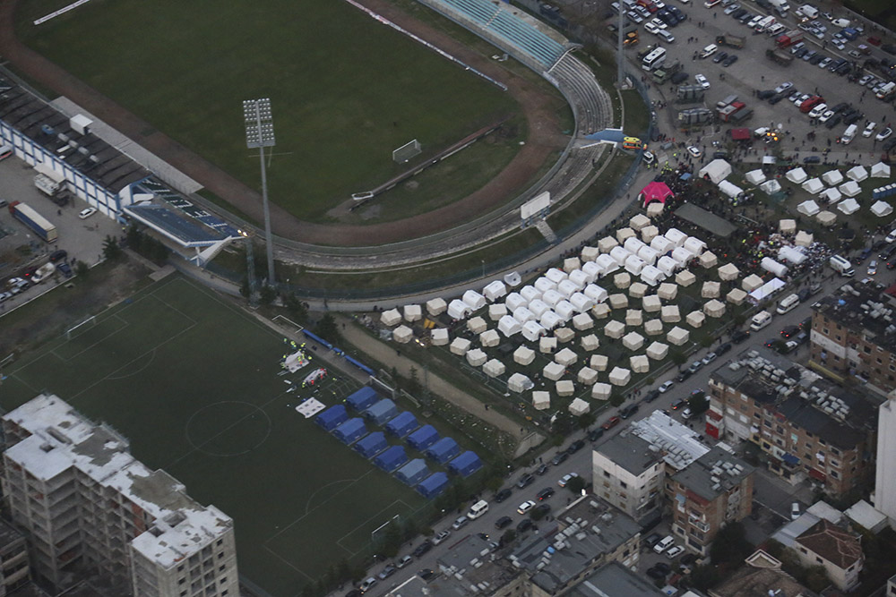 Aerial view showing emergency tents being set up on football fields as emergency housing for people displaced by the earthquake in Albania.