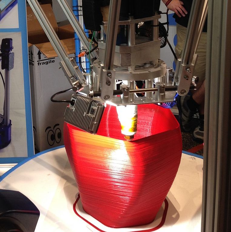 A large delta-style 3D printer by SeeMeCNC capable of printing an object with up to 4 feet in diameter and 10 feet in height.