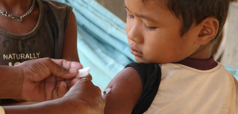 Cambodian boy receiving measles vaccine