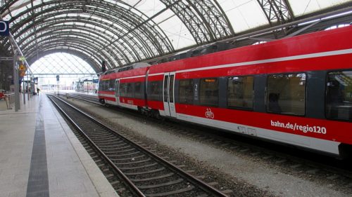 Red train at the Hauptbahnhof in Dresden, Germany.