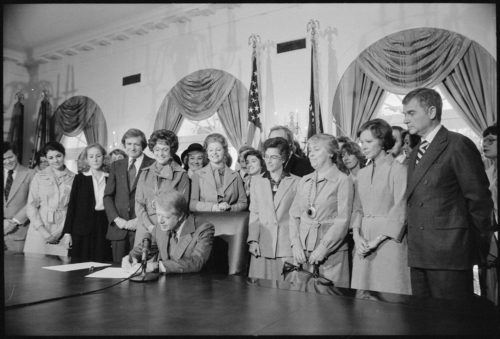 Photograph of Jimmy Carter Signing Extension of Equal Rights Amendment (ERA) Ratification, 10/20/1978
