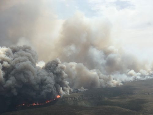 Aerial view of large Australian bushfire burning with lots of smoke.